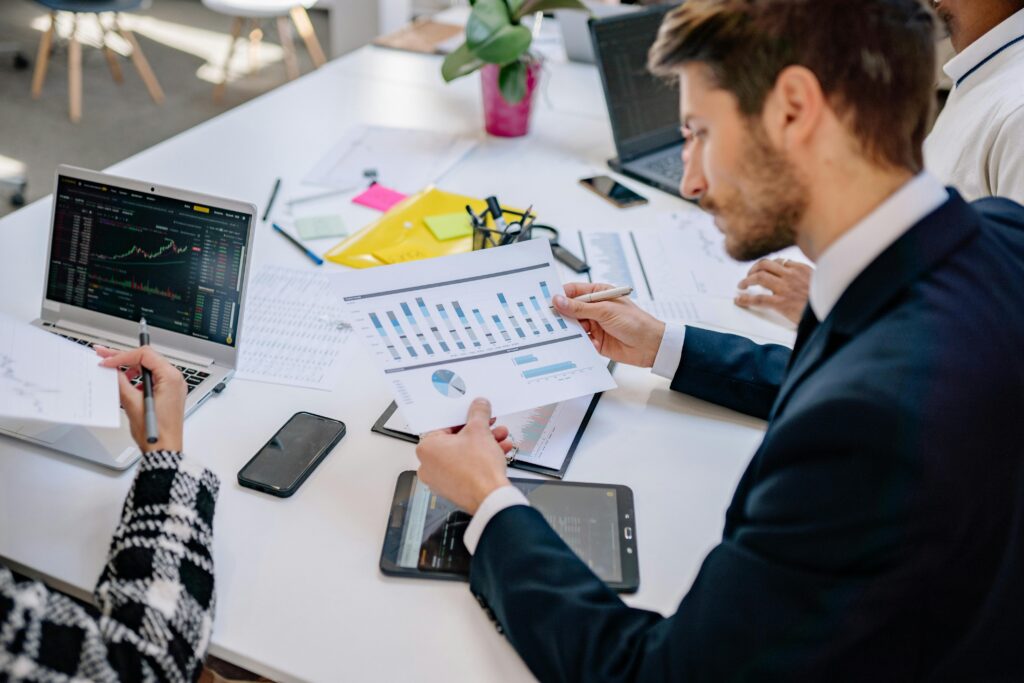 Business professionals reviewing charts and performance data, representing analytics, strategic planning, and informed decisions.
