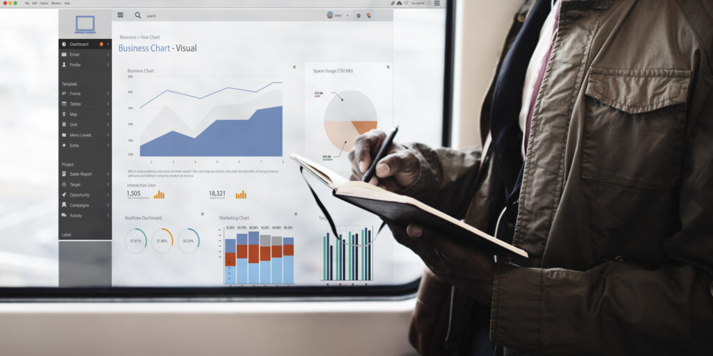 Professional reviewing performance dashboards and reports to evaluate managed services, IT strategy, and business outcomes.